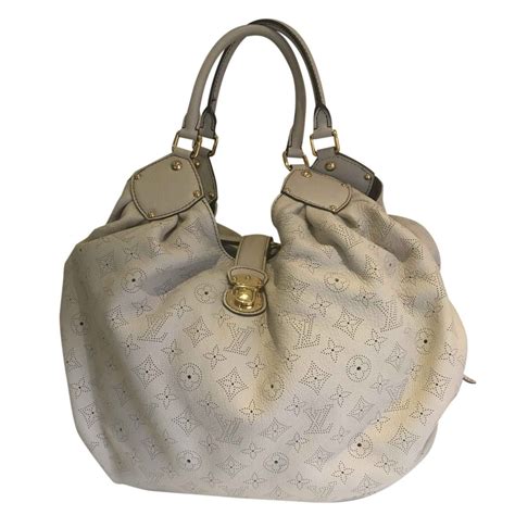 cream louis vuitton bag|louis vuitton mahina bag price.